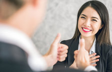 Boss giving employee thumbs up